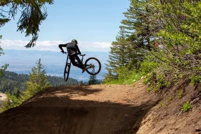 Ski Idaho This Summer: 60 percent of Idaho ski areas offer summer mountain biking adventures : Cody Underkoffler performs a whip last weekend on the first jump on Air Traffic Control, one of nine new mountain bike trails at The Basin Gravity Park, a new attraction Bogus Basin opened last summer. 