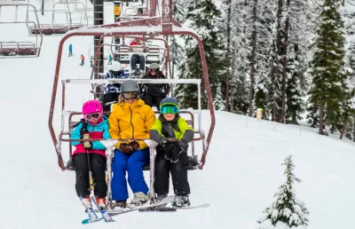All 19 Idaho ski areas open during the holidays : KELLOGG, Idaho (Feb. 19, 2017) -- Youths Hudson and Hazel Hollatz and their mom Nikki enjoy a day skiing and riding at Silver Mountain in North Idaho. Silver Mountain is among 17 destinations that participate in the Idaho Peak Season Passport program, which lets 5th and 6th graders ski or board three days or two days for free, respectively, at ski areas throughout the state. The program targets 5th and 6th graders because a lot of them don't know how to ski or snowboard yet and nationwide resorts have found that kids in those grades are at an age where they can learn quickly and enjoy the sports. It's also a good time to reengage former skiers and riders, because their kids are old enough the whole family can enjoy skiing and boarding together. Visit skiidaho.us/passports for more details. (Photo by Colin Meagher for Silver Mountain Resort)