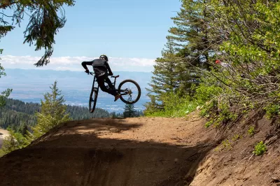 SKI IDAHO THIS SUMMER : Cody Underkoffler performs a whip last summer on the first jump on "Air Traffic Control" at The Basin Gravity Park, a new attraction Bogus Basin Mountain Recreation Area opened in 2021. Eleven of Idaho's 19 ski areas offer mountain biking in the summer, as well as scenic chairlift and gondola rides, hiking and trail running, disc golf, zipline tours, horseback riding, and more. Visit skiidaho.us for more details. (Photo by Ron Welton for Bogus Basin Mountain Recreational Association)