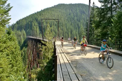 SKI IDAHO THIS SUMMER : Attracting 70,000 riders each summer, the Route of the Hiawatha is by far the most popular ski area bike trail in the U.S. and is celebrating its 25th anniversary this summer. Considered the crown jewel of the nation's rails-to-trails initiative, the 15-mile Route of the Hiawatha's gentle 2-percent, all-downhill ride straddles the Idaho-Montana state line, delves 10 tunnels, crosses seven sky-high train trestles, and sports shuttle service. Lookout Pass, a nearby ski resort in north Idaho that also straddles the Montana state line, operates the trail under a permit from the U.S. Forest Service. It is among 11 Idaho ski areas that offer summer mountain biking adventures, scenic chairlift and gondola rides, hiking and trail running, disc golf, zipline tours, horseback riding, and more. Visit skiidaho.us for more details. (Photo by Matthew Sawyer for Lookout Pass Ski and Recreation Area)